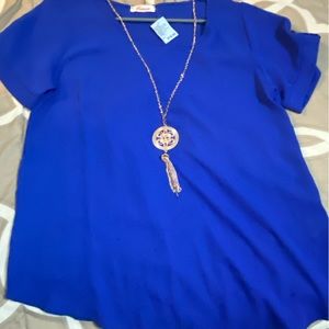 New with tags. Size large. Blue Blouse